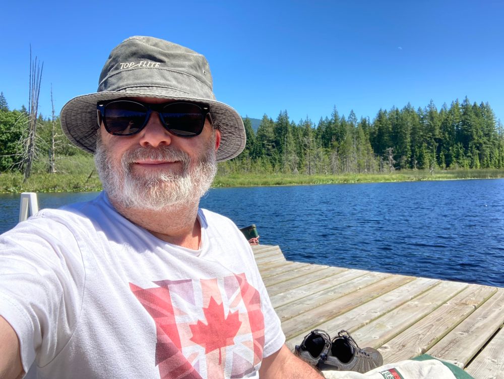 Sean on the float in the middle of the lake wearing one of his few maple leaf themed bits of gear (a London Olympics team Canada shirt from The Bay) 