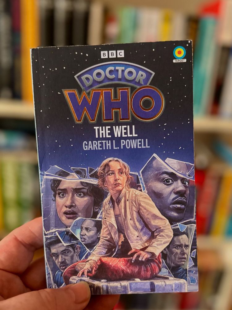 A paperback copy of DOCTOR WHO: THE WELL by Gareth L Powell. 