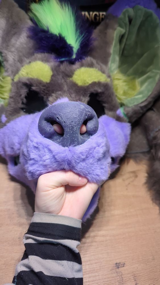 Same head this time with fur and shoes that the nose has holes though to the inside.
Shown via a hand going in the mouth and through the nose poking fingers