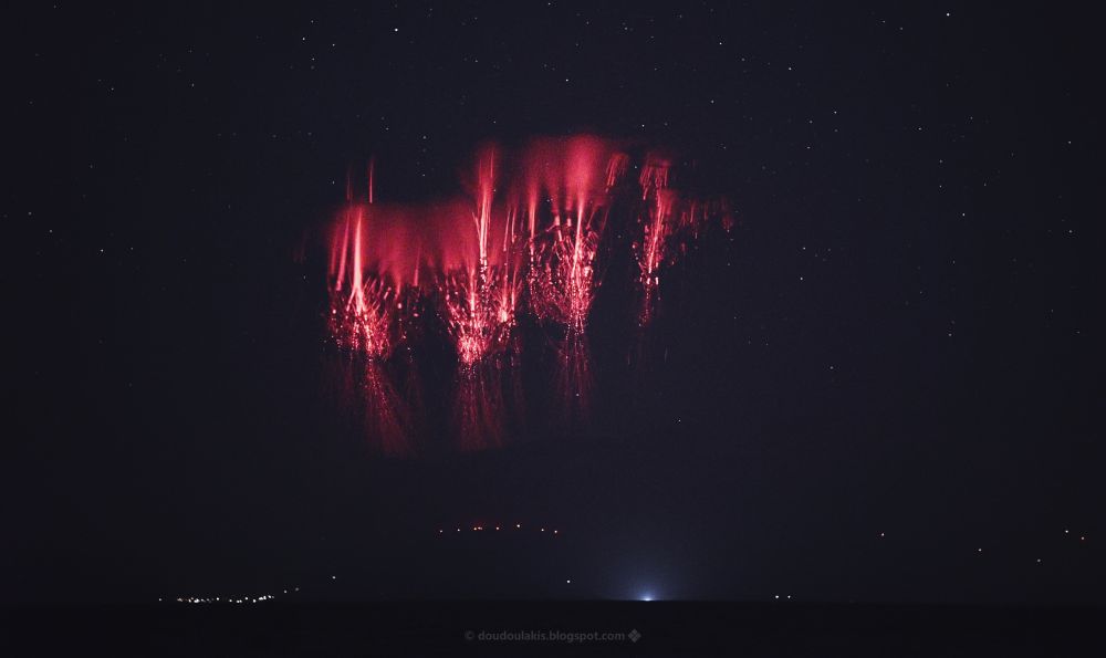 Nightscape with big red sprites ("Jellyfish" sprites) and the mountains of Evia isl. below.