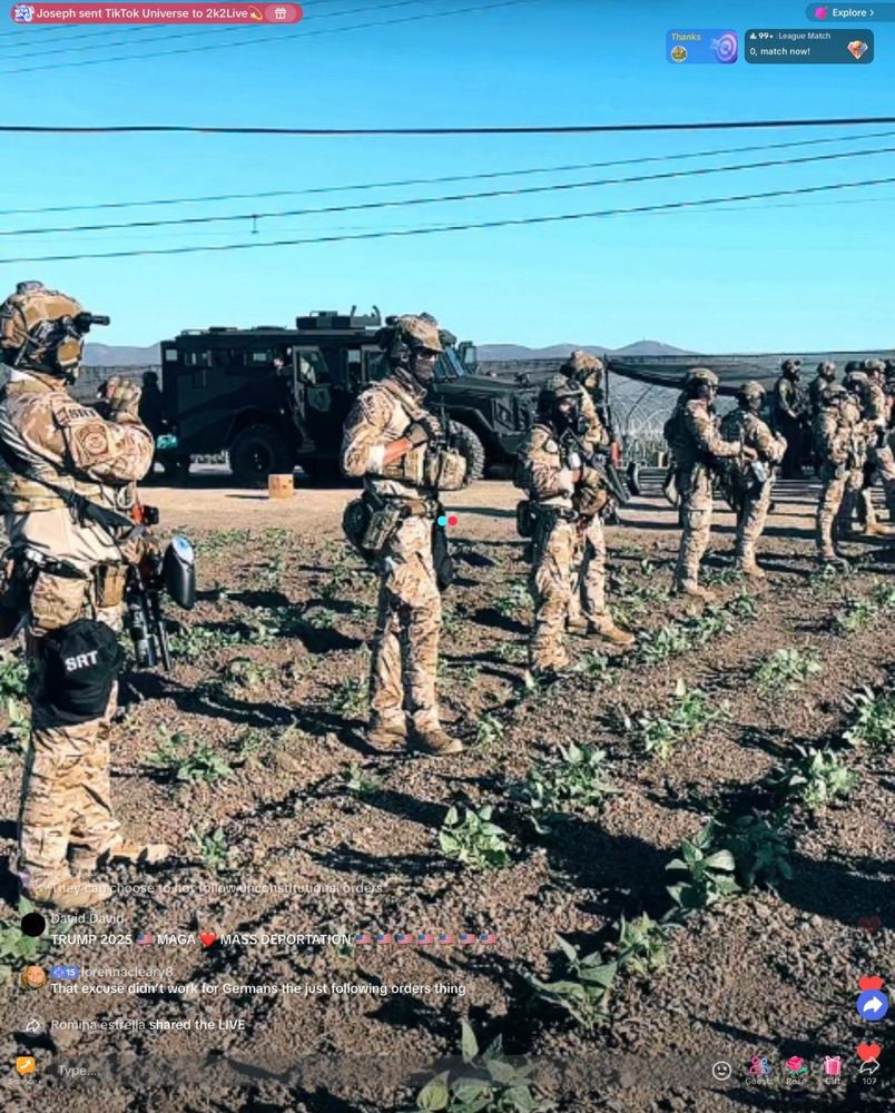 Fascist stormtroopers in full battle dress marching across a large produce field  in California attacking immigrants and others 
