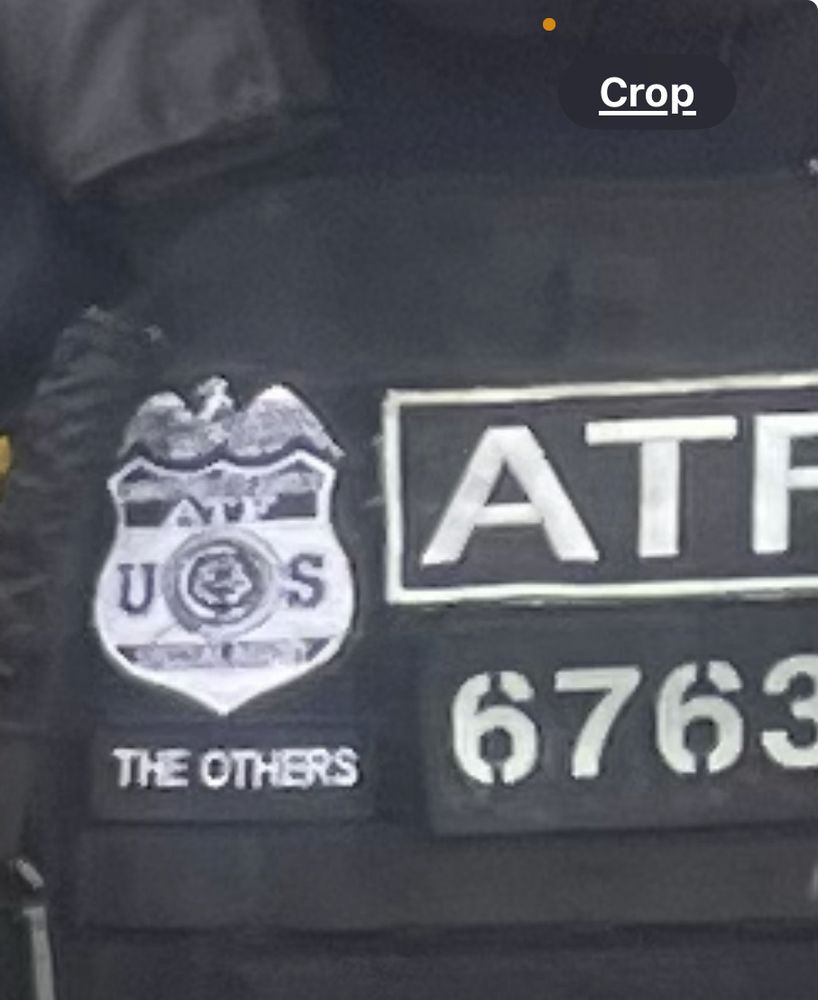 A picture of one of the agents name tag saying “the others” in place of their name. 