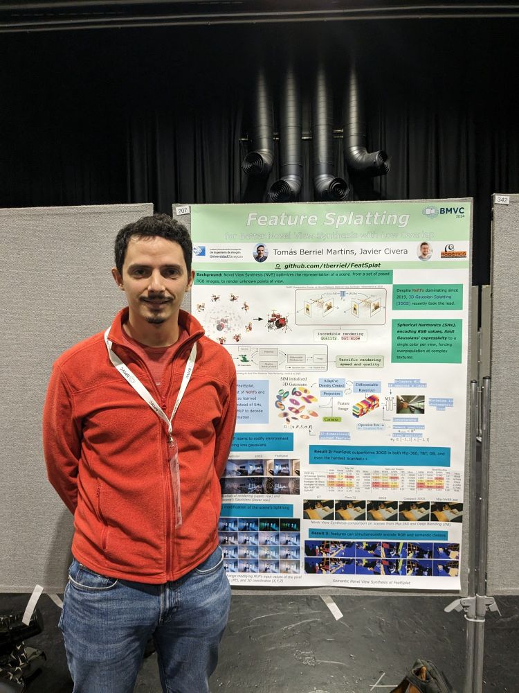A young researcher in front of it's poster.