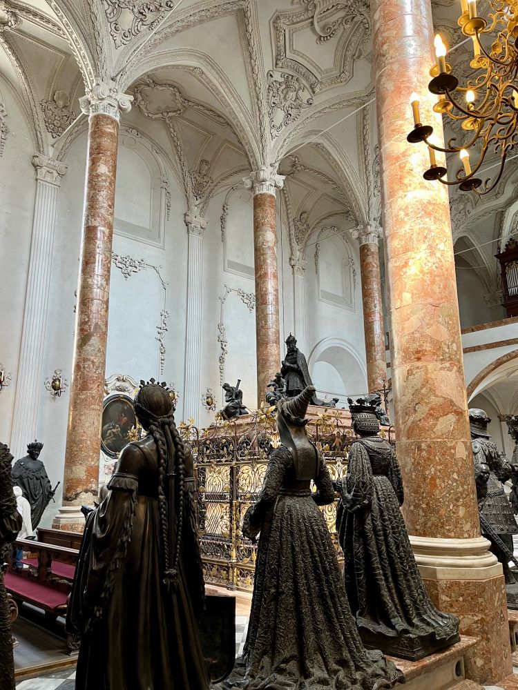 Interior shot of the Hofkirche with tomb of Maximilian and statues