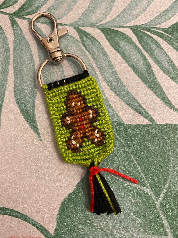 gingerbread person on green knotted keychain