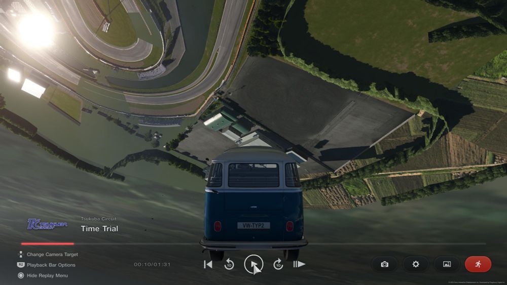 A Volkswagen van launched in the air. Upside down with a view of the out of bounds area