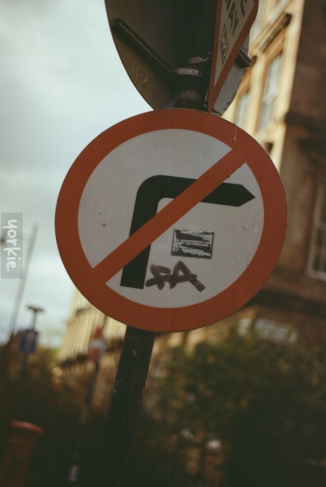 no right turn sign with a sticker that says no government can control you