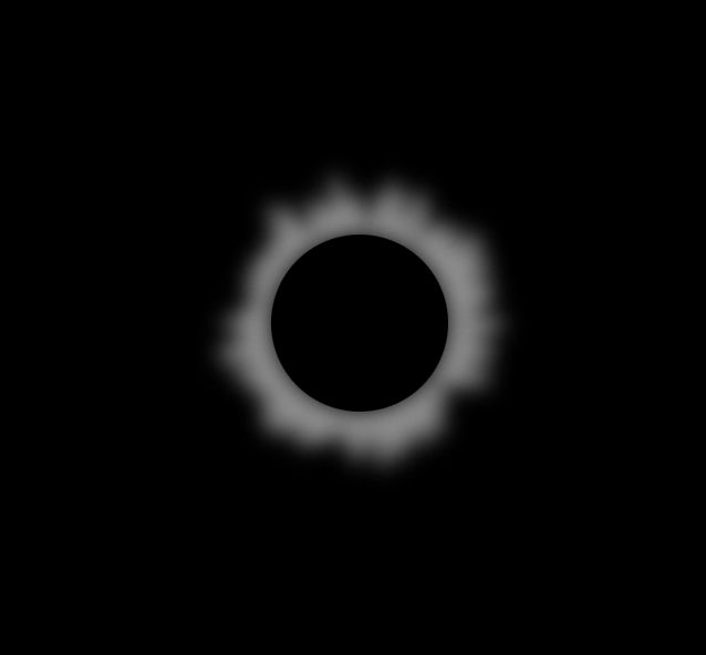 An image recreating an eclipse, with a blurred corona effect behind a black circle.