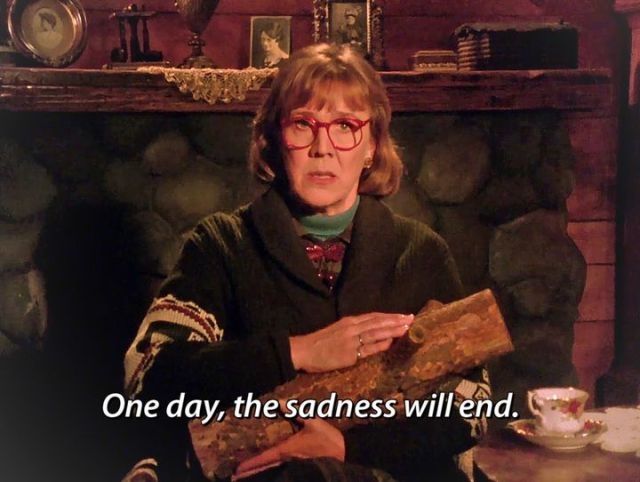 Log Lady holding her log.
Quote: One day, the sadness will end. 

Aus Twin Peaks. 
