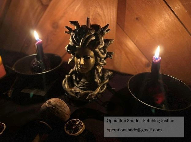 Photo of Medusa backflow incense burner. On each side of her is a bowl with a rotten apple and a candle burning in it. Before her are a large nut and dried fruit. 
Text: Operation Shade - Fetching Justice
operationshade@gmail.com