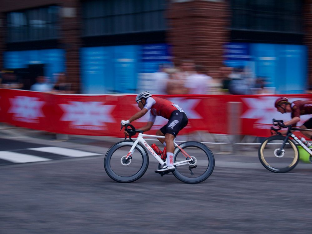 Cyclist racing on road bikes on a city street in Chicago’s Fulton Market