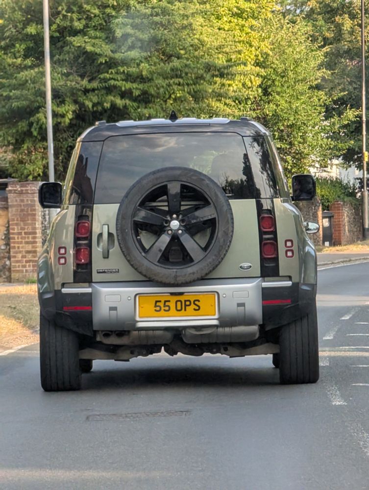Car with number plate 55 OPS.