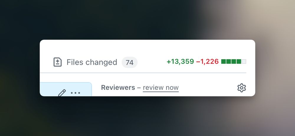A snippet of GitHub PR showing 74 files changed with +13k and -1,2k line changes
