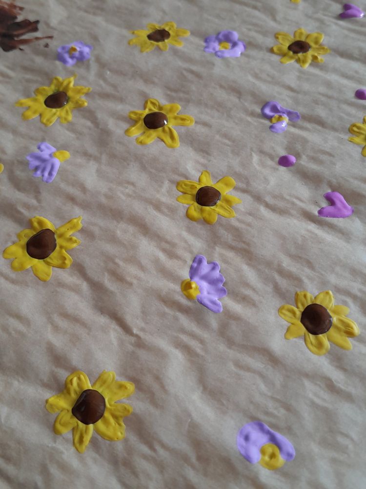 Mini flowers and hearts painted with acrylic paint