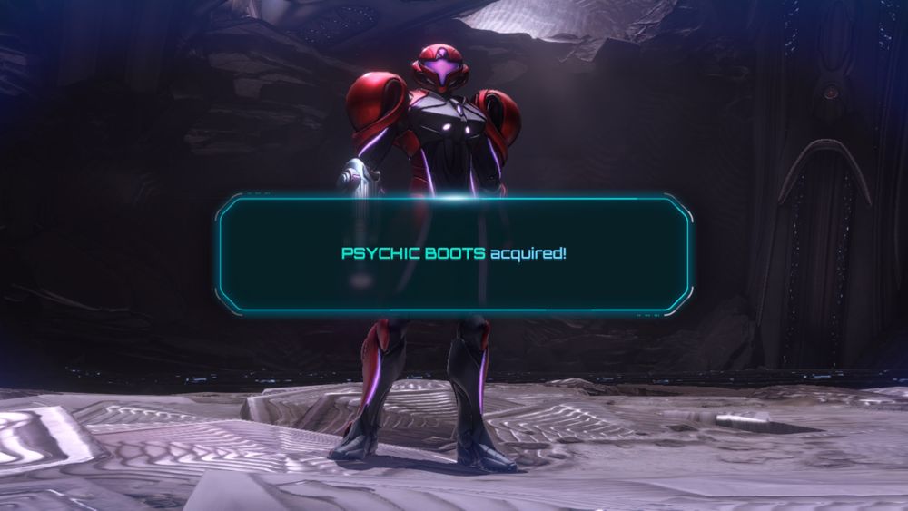 Screenshot from Metroid Prime 4. Samus Aran stands facing the camera with a UI element in front of her announcing that she has obtained Psychic Boots. 