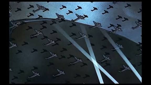 Image du clip Pink Floyd : Goodbye blue sky ou les avions de guerre parcours le ciel tout en se transformant en croix De tombes enchainé dans le clip en drapeau UnionJack qui perd ses parties (morts) pour terminer en Croix de Crucifixion qui se met a saigner (le rouge du drapeaux RUISSELLE) et irriguer la terre sous lui