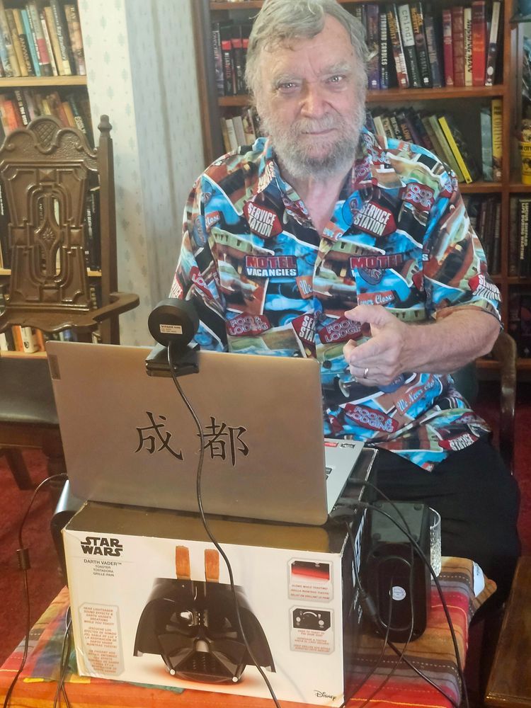 Michael Swanwick at his computer, which sits on a box for a Darth Vader toaster