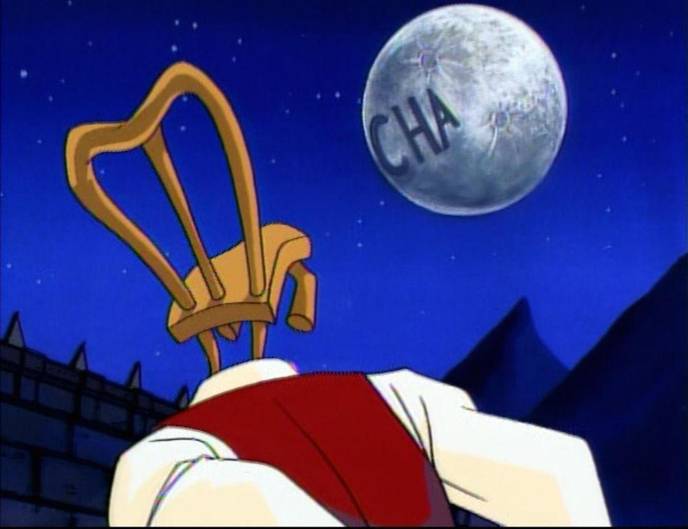 Chairface from The Tick looks up at the moon with “CHA” etched in the surface 