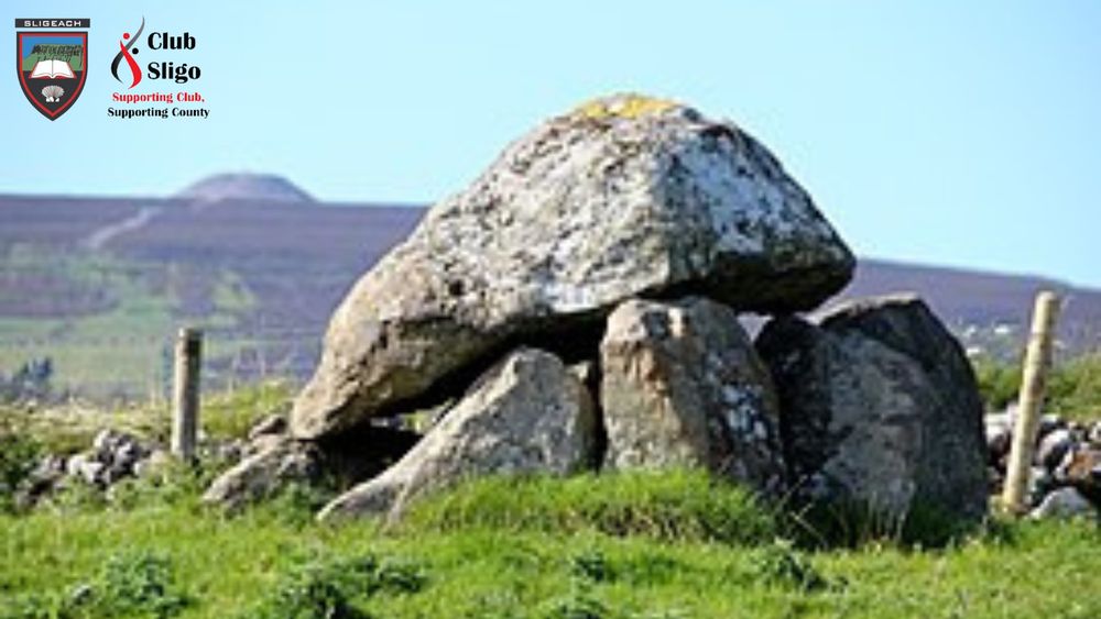 Megalithic tomb at Carrowmore with the cairn on top of Knock na Rea in the background