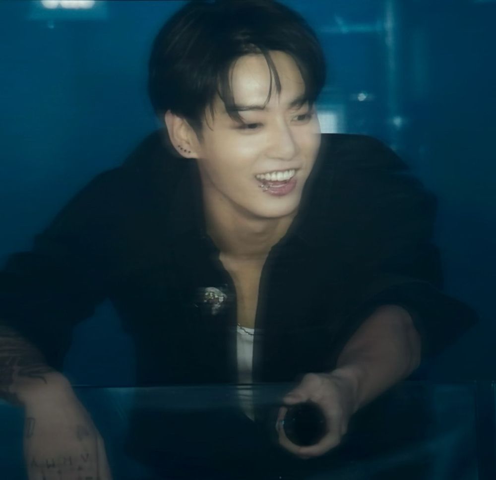 jungkook at uh probably his times square golden pop up show looking over the crowd smiling like a baby and also like namjoons husband bc he is