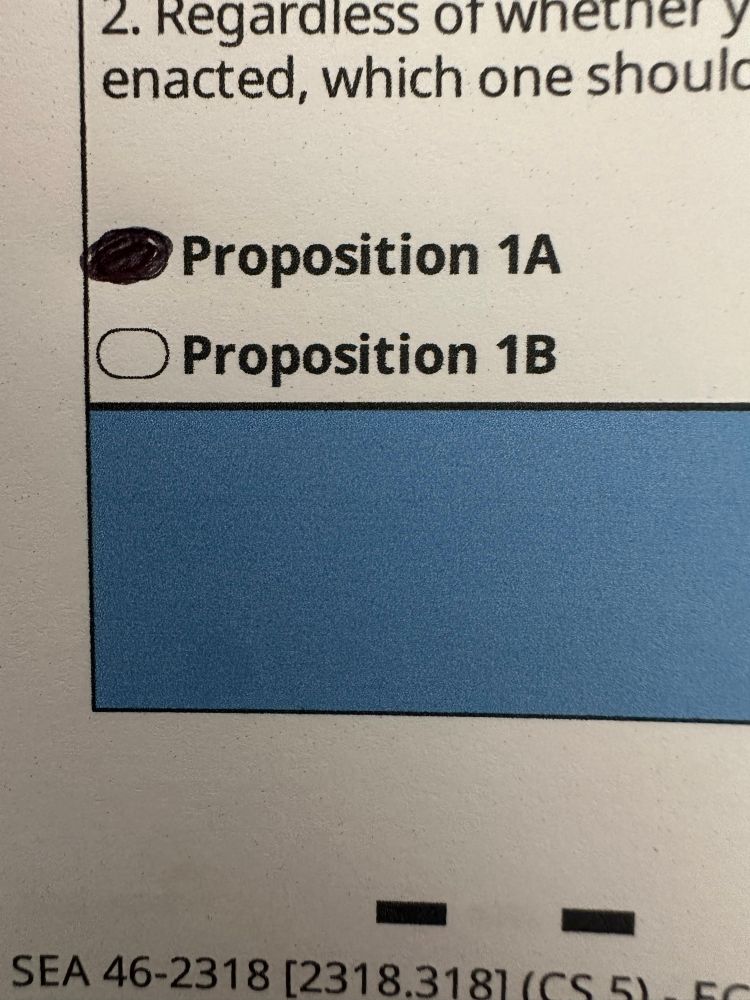 A king county Washington ballot showing the bubble for proposition 1A filled in, as in a yes vote. 