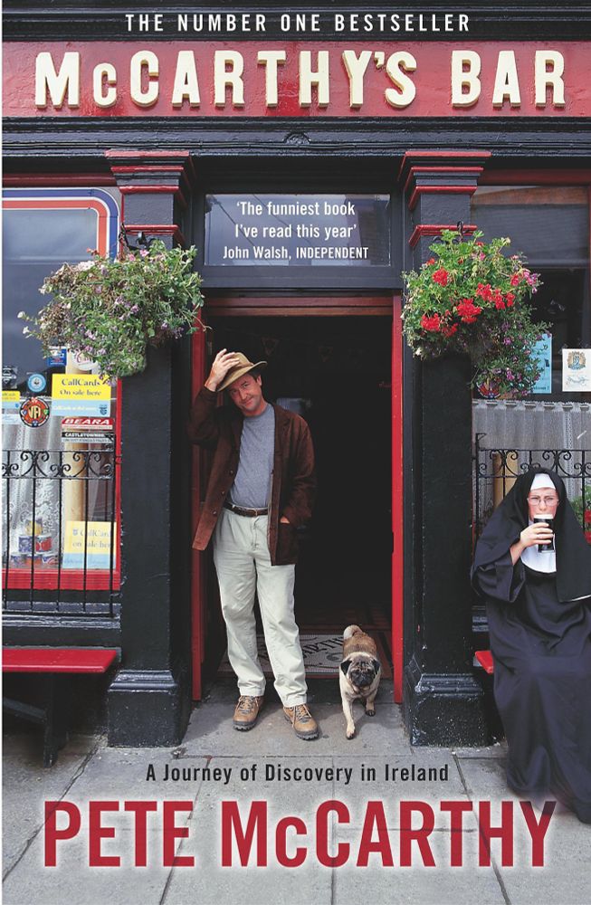 Photo of the cover of McCarthy’s Bar (a no.1 bestseller). The author is standing outside a red and black Irish pub - McCarthy’s Bar - about to raise his hat. He is very middle aged English man. There is a dog at his feet and a nun drinking a pint of stout to his right. I am still very sad that he died. 