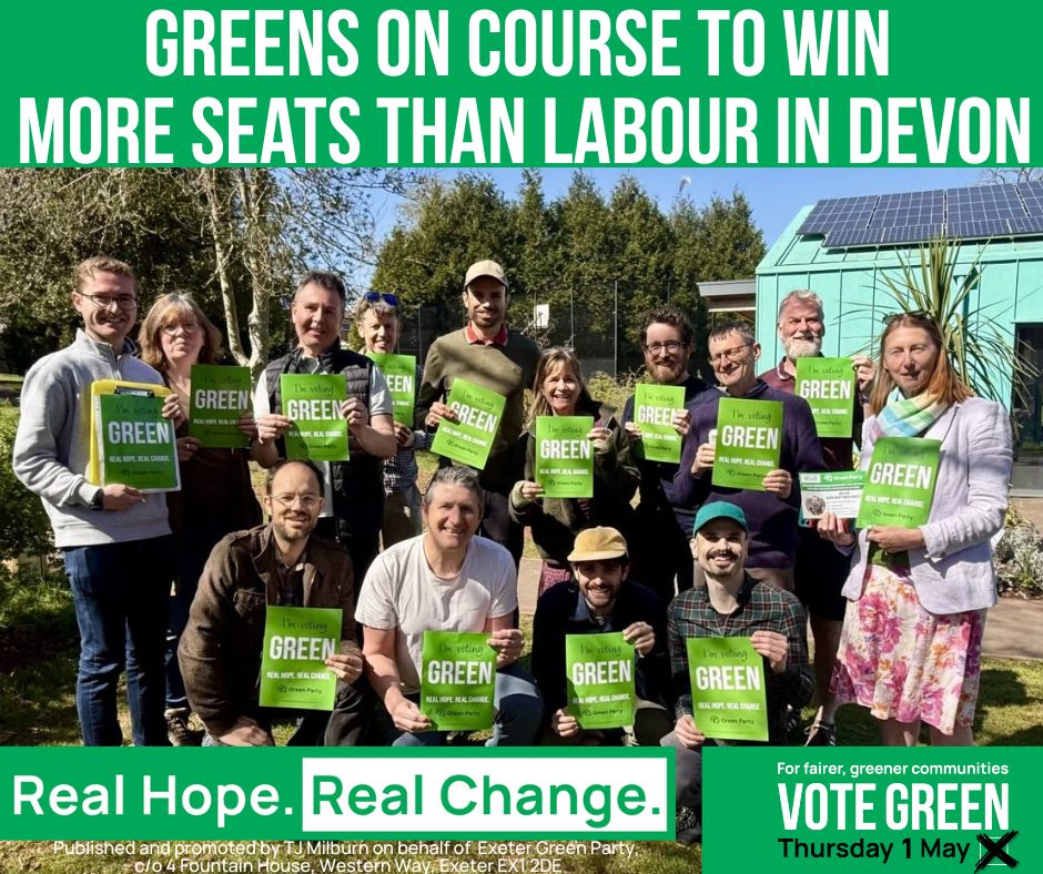 An image of Green Party councillors, candidates and campaigners holding up posters reading "I'm voting Green." Emblazoned across the top of the image is:  Greens on course to win more seats than Labour in Devon.
