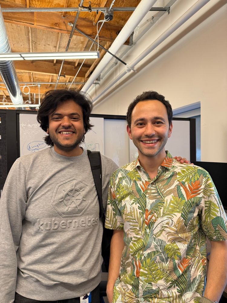 Madhav and Ahmet in the office