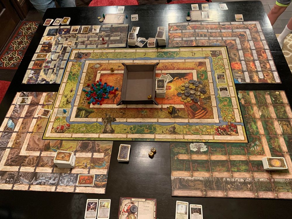 A board game made up of several concentric rectangles. Additional boards have been added to the corners of the original.