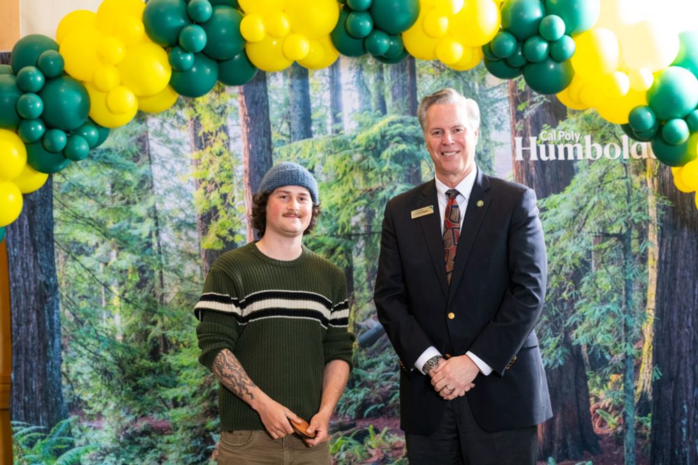 Honorable mention Garrett Kitchen poses with President Spagna