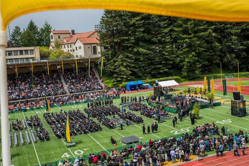 Overview of Humboldt graduation on the redwood bowl field.
