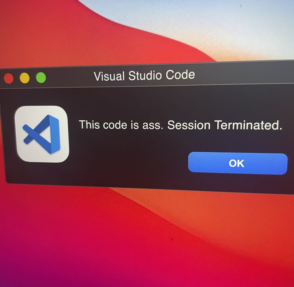 A photo of a Mac system alert from Visual Studio Code saying "This code is ass. Session terminated."