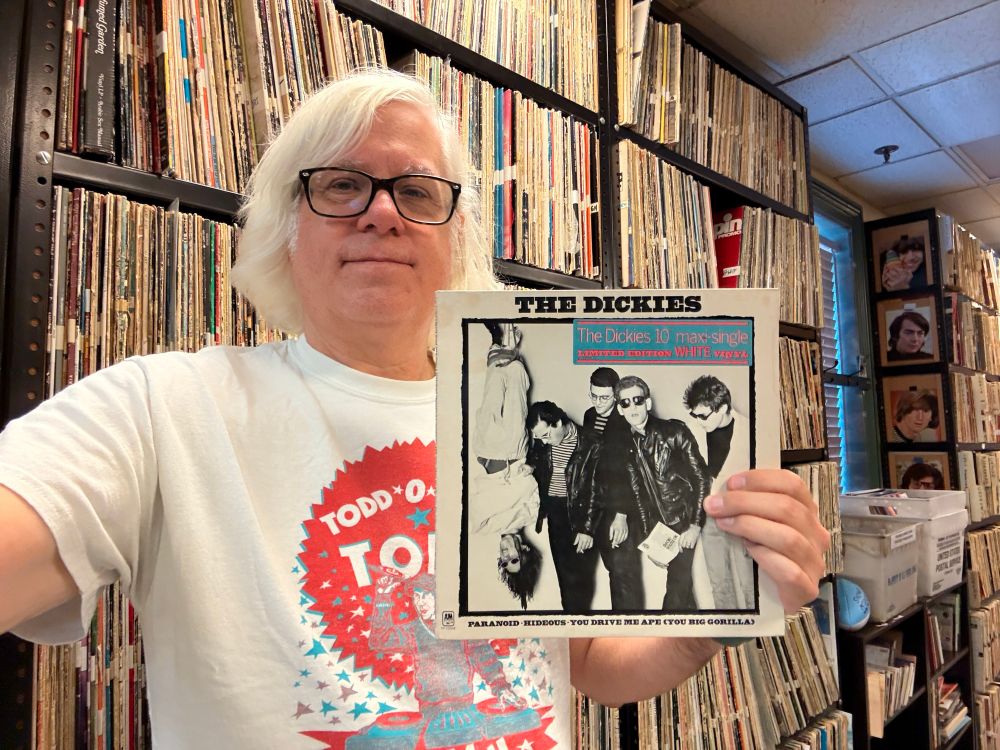 Me holding a copy of the Dickies 10” with their cover of “Paranoid”