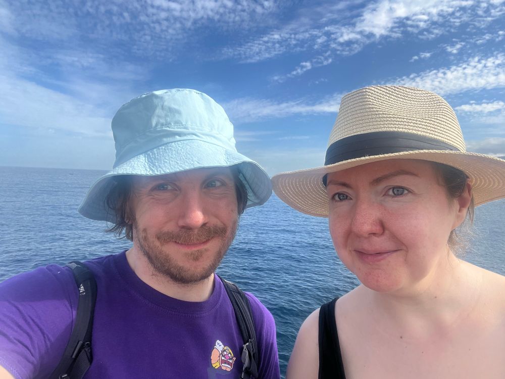 Tourists in front of an ocean