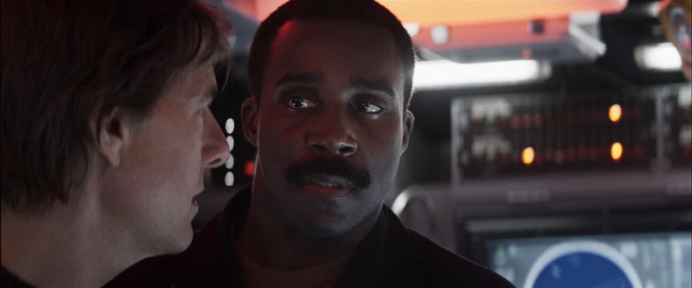 Severance's Tramell Tillman looking at Tom Cruise in Mission: Impossible – The Final Reckoning