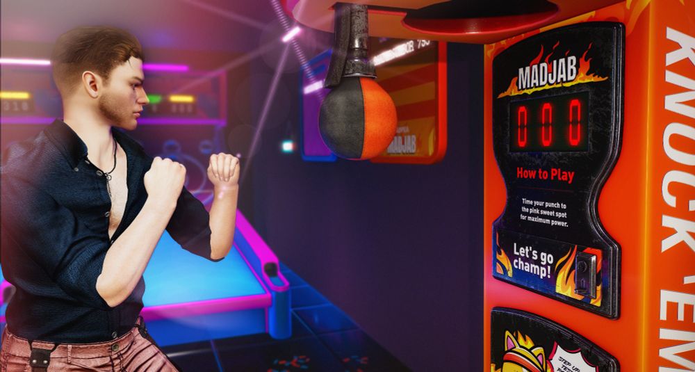 Picture shows a man in a boxing pose in front of a Boxing Arcade Machine. He's ready to hit the punching bag. Can he make a new highscore? This is a blog picture for MadPea Productions.
