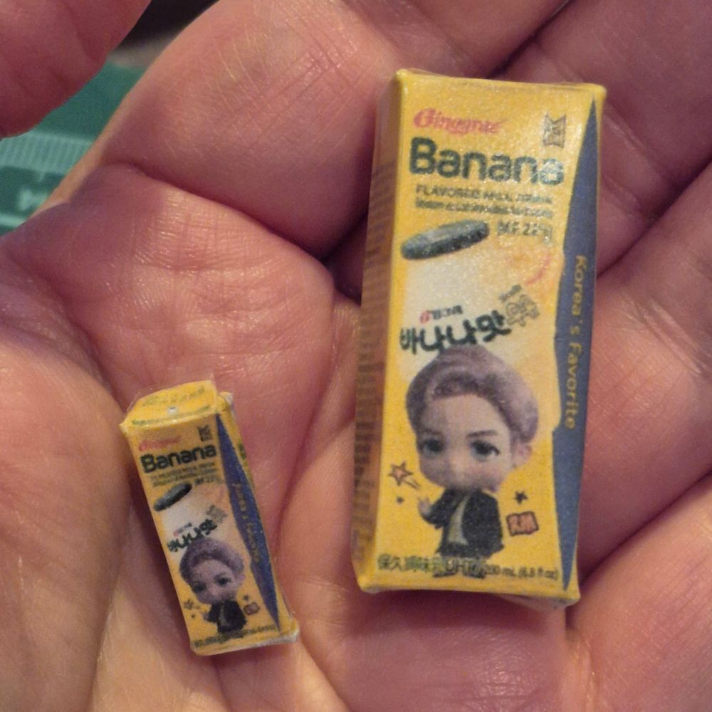 Miniature papercraft of binggrae banana milk boxes.