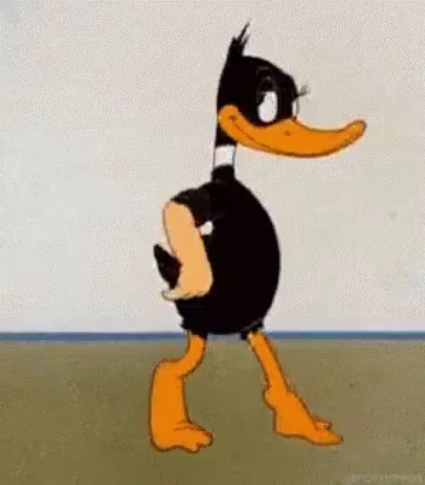 a cartoon duck is standing in front of a wall without a shirt on .