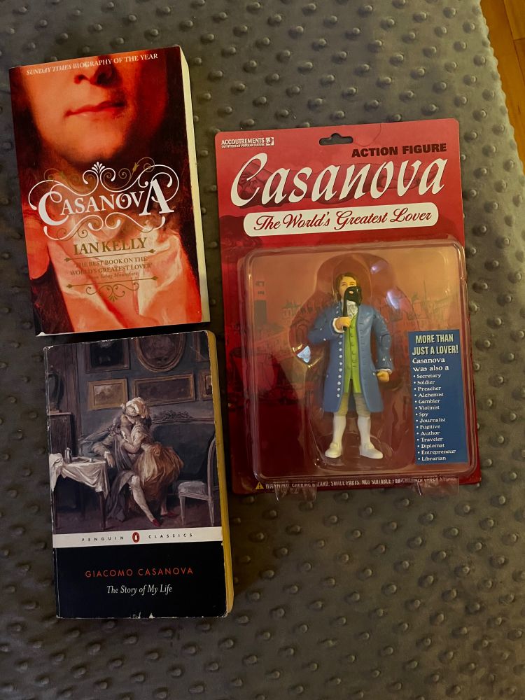 Biography of Casanova by Kelly. The Story of My Life by Casanova. An action figure of Casanova in its packaging