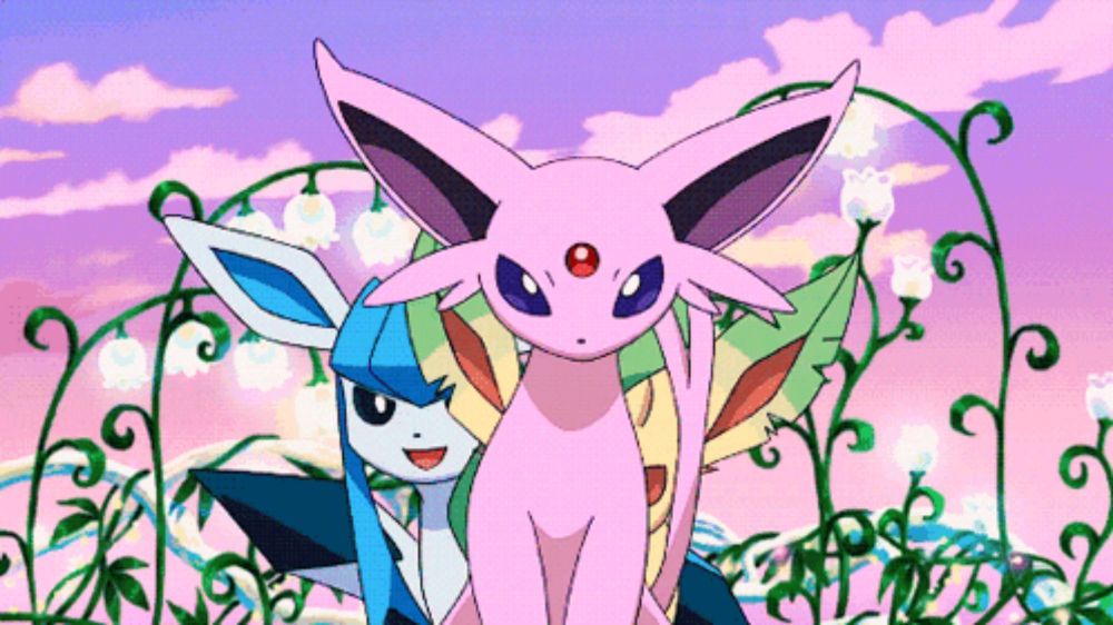 a pink pokemon with a red eye is standing next to another pink pokemon