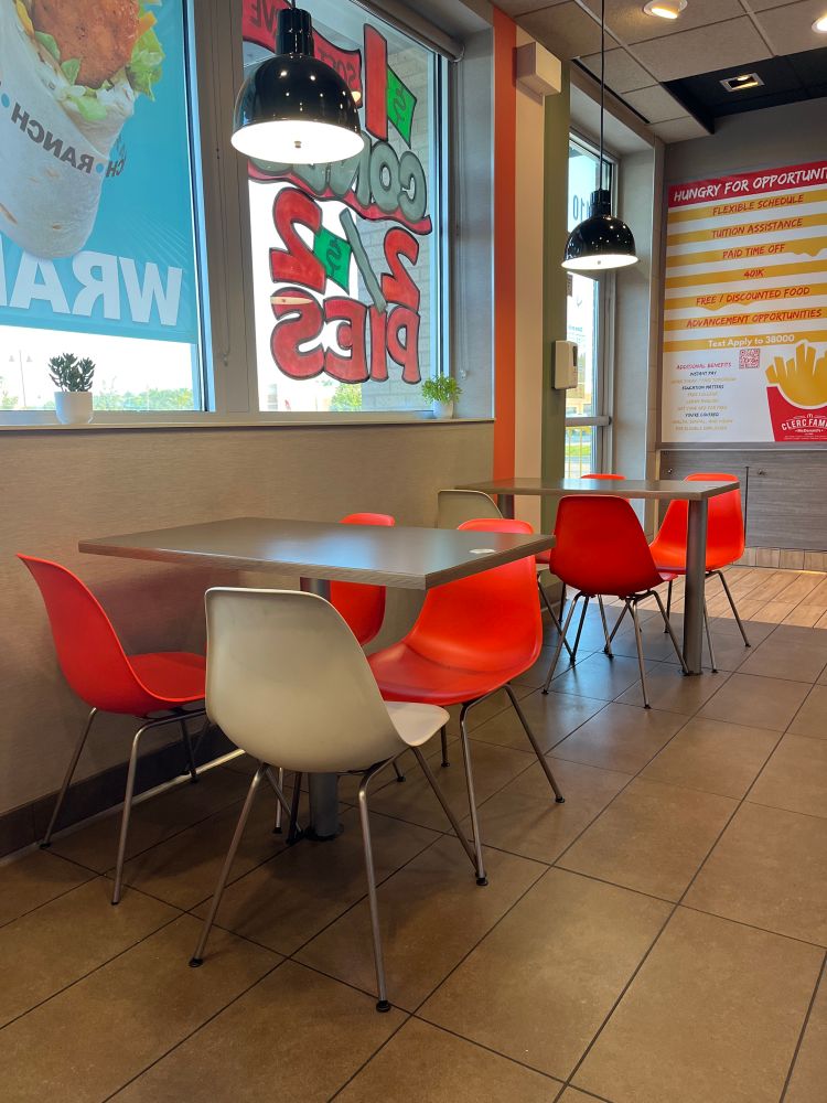 McDonald’s interior with white and orange molded plastic chairs