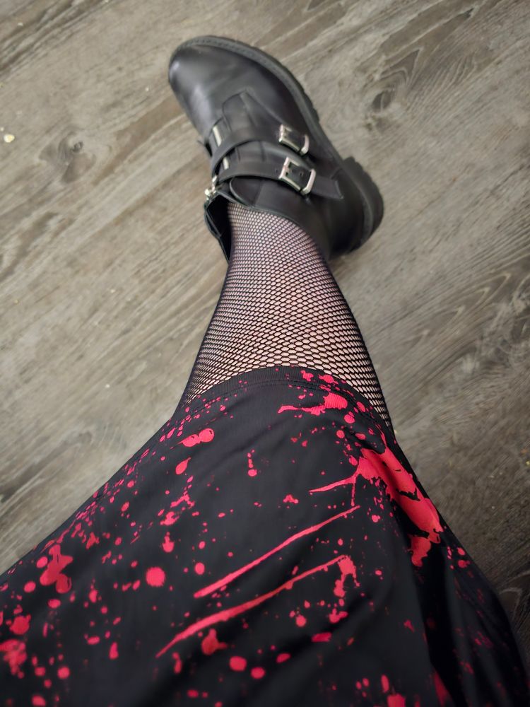 Rain's leg with bloodspattwr dress, fishnets & black boots