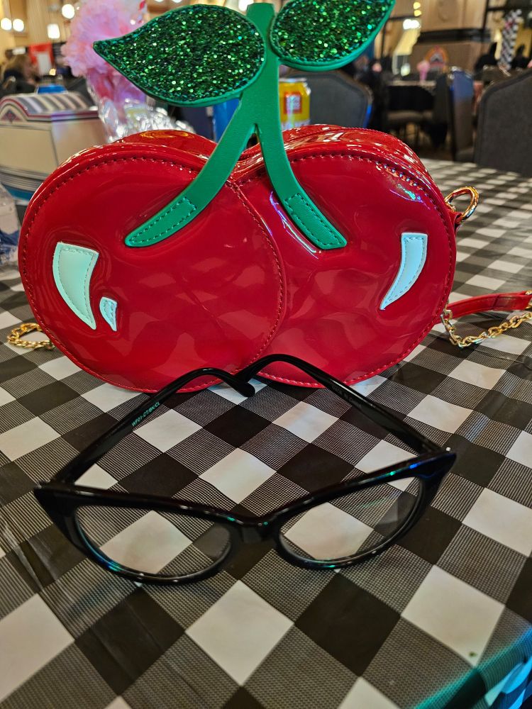 Cherry purse & black cat eye glasses