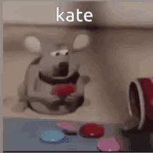 Gif of a cute mouse (or rat) eating smarties, with the name "kate" on the image.