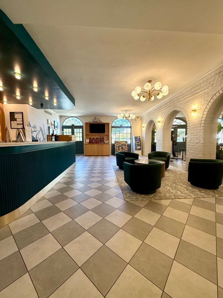 Bar on the left chairs on the right leading up to the coffee bar with Lego river boat atop.