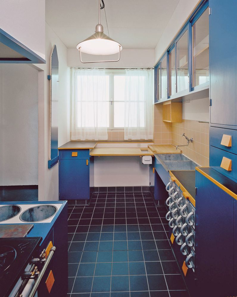 A photograph of the frankfurt kitchen, in blue and orange trim.