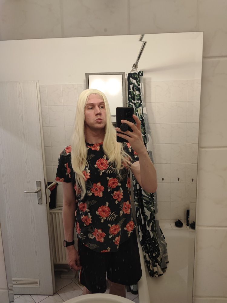 Mirror selfie out of drag with a long platinum blonde wig
