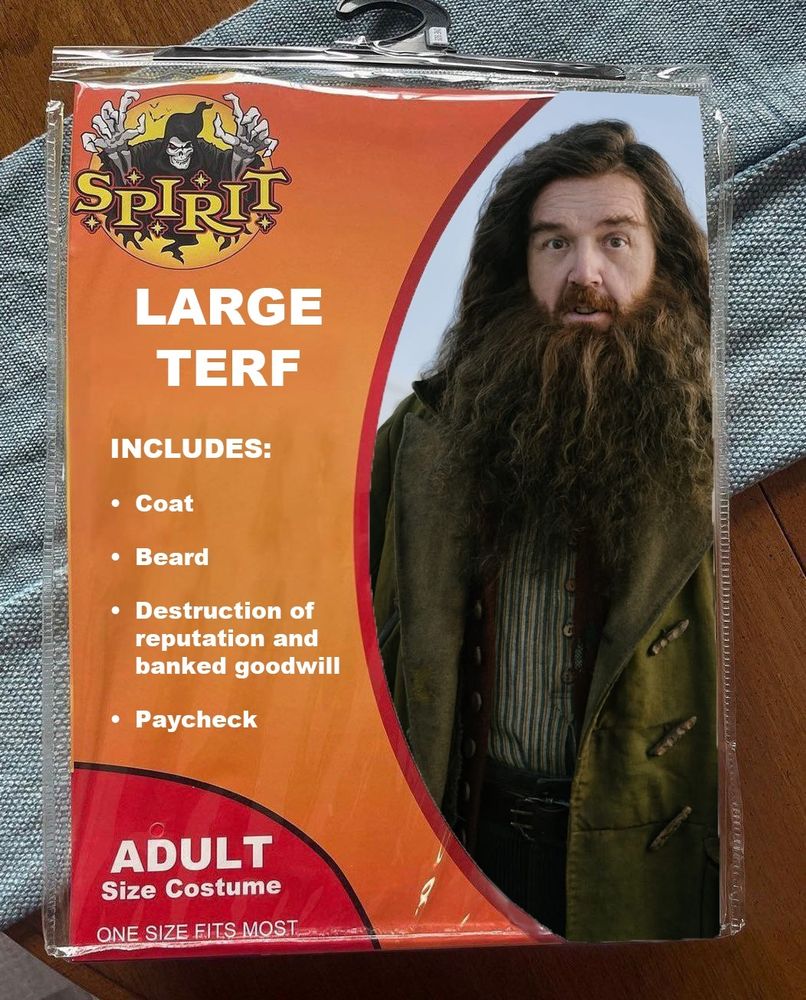 A satirical Spirit Halloween costume package labeled "LARGE TERF." The package features a photo of actor Nick Frost with long, bushy hair and a large beard, resembling the character Rubeus Hagrid from Harry Potter. A bulleted list specifies that the costume includes a "Coat," "Beard," "Destruction of reputation and banked goodwill," and a "Paycheck."
