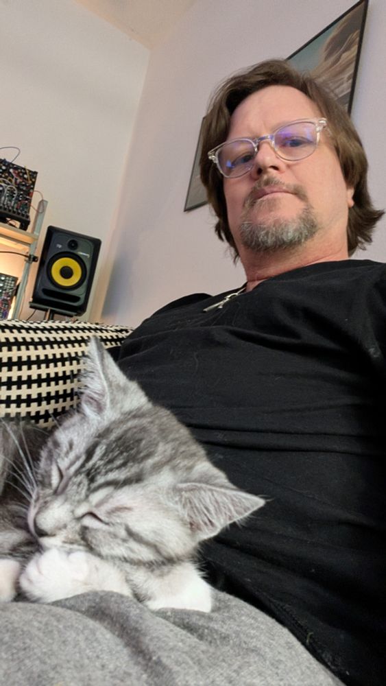 Selfie with me and little Pinky the grey and white tabby kitten in my lap