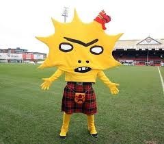The Partick Thistle FC mascot. It's a yellow, spiky thistle for a head, has a yellow body and is wearing a kilt